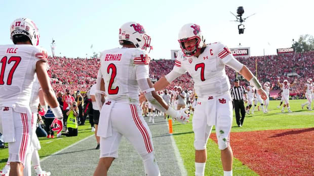Utah Utes running back Micah Bernard (2) celebrates a touchdown with quarterback Cameron Rising (7) and wide receiver Devaughn Vele (17) during the first quarter of the Rose Bowl in Pasadena, Calif. on Jan. 1, 2022. College Football Rose Bowl.
